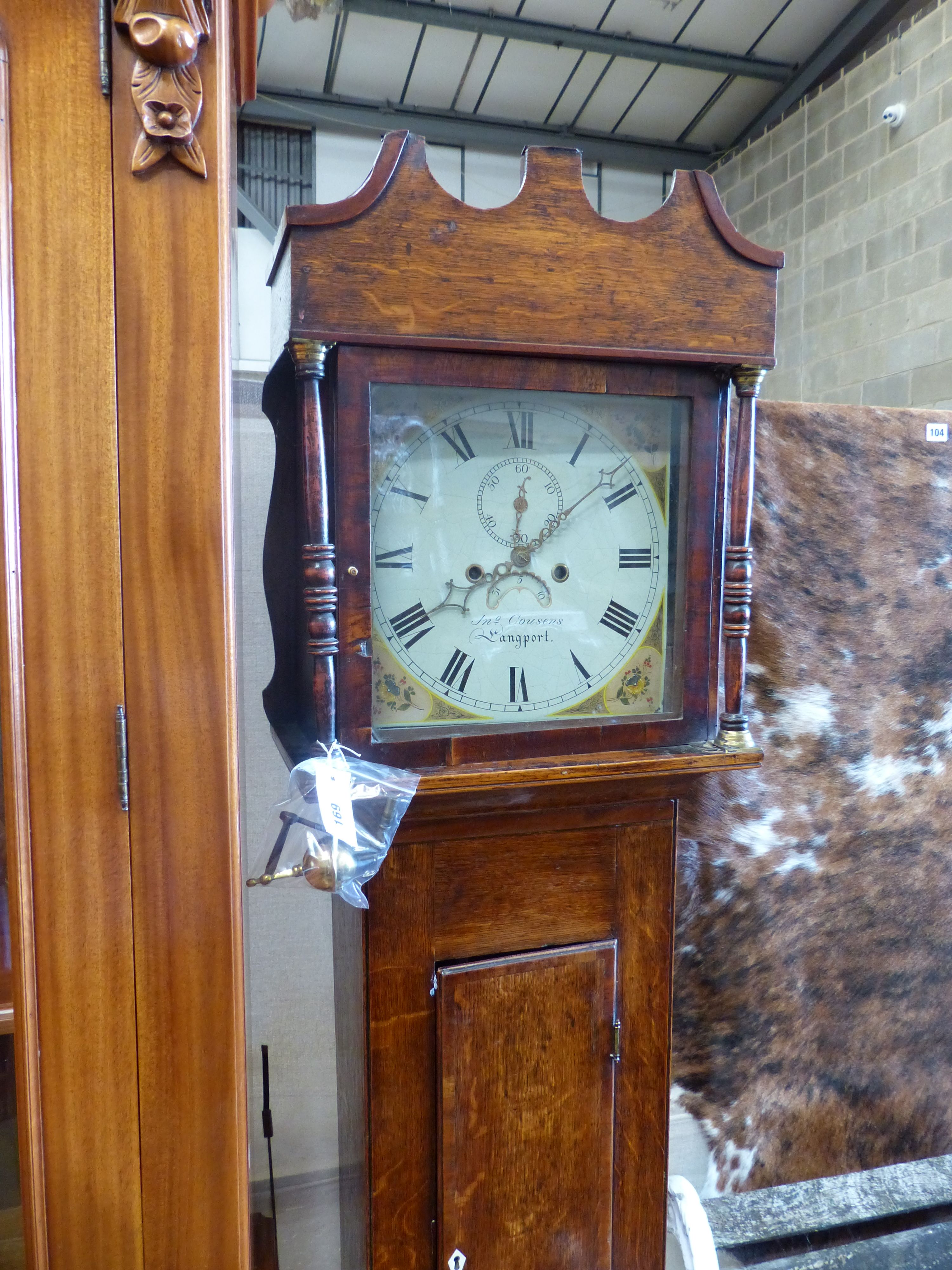 An early 19th century oak eight day longcase clock, marked Cousens Langport, height 194cm